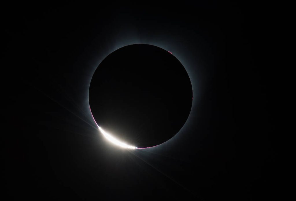 The Diamond Ring  effect is seen as the moon makes its final move over the sun during the total solar eclipse on Monday, August 21, 2017 above Madras, Oregon. Photo Credit: (NASA/Aubrey Gemignani)